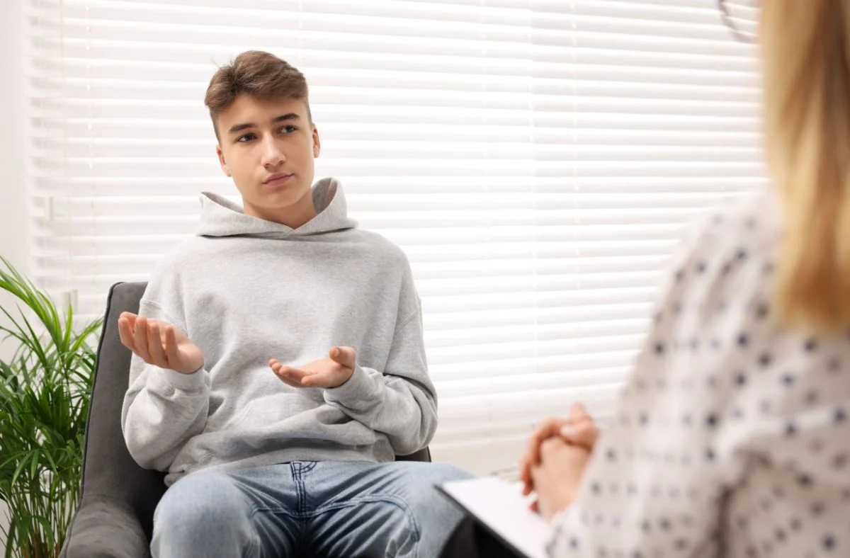 An ADHD counselor is working with a young man Book a free 20-minute intro call with Uniquely Wired Wellness to learn more about in-person therapy and virtual counseling in Alexandria, Northern Virginia, and the DC Metro area.